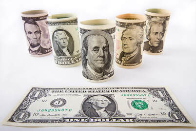Picture of different denomination cash: $1, $5, $2, $100, $10, $20
