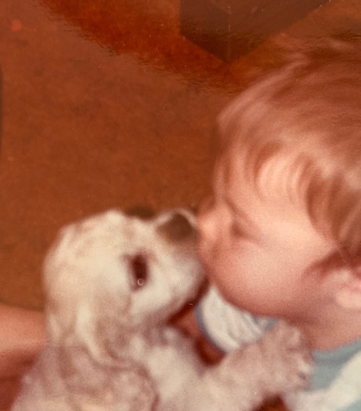 Picture of Dr. Kerr as a toddler with little dog